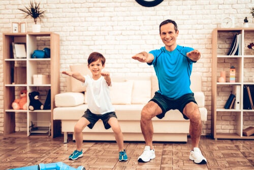 A father and son exercising.