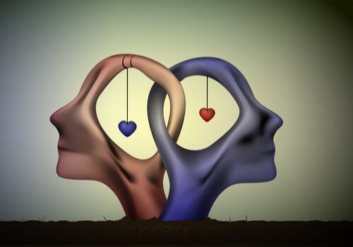 Two heads and two hearts interlocked.