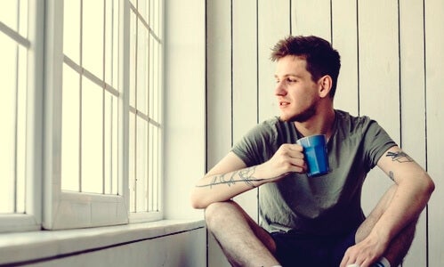 A man drinking coffee.