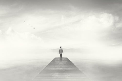 A man walking in the fog.