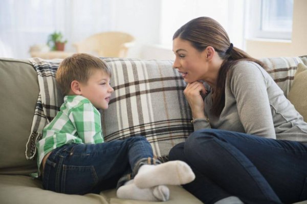 A mother talking to her son.