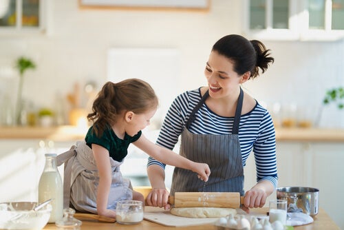 A mother and daughter in the kitchen.