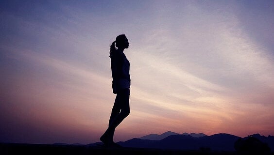 A woman looking at the sky.