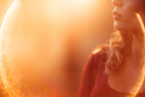 A woman surrounded by sunlight.