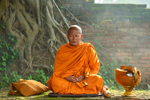 A person meditating.