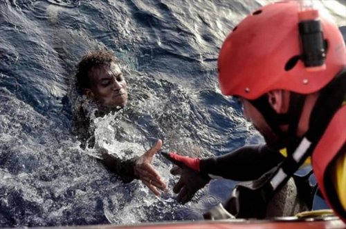 A person rescuing another.
