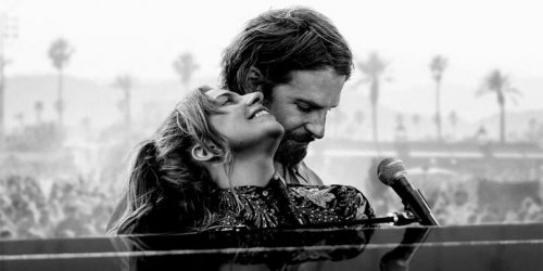 Two people in a piano.