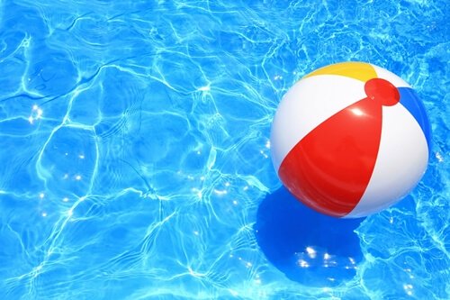 A beach ball in a pool.