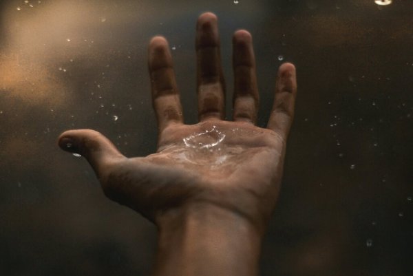 A hand catching water.