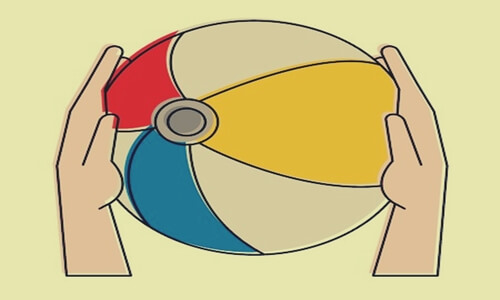 Hands holding a beach ball.