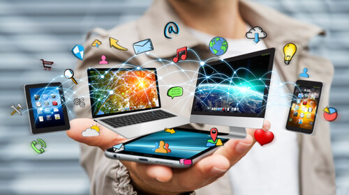 A person showing all kinds of new technologies.