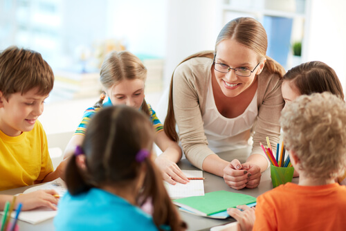 A teacher and some children.