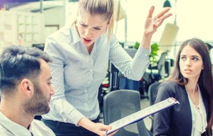 A woman arguing with her coworkers.