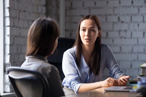 A woman interviewing someone.