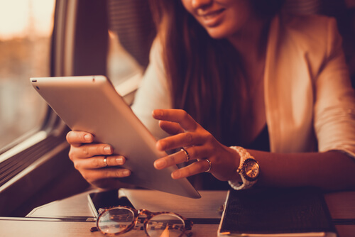 A woman using an iPad.