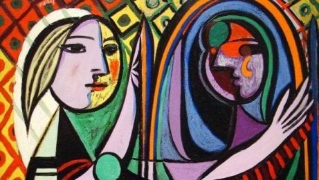 A woman looking in the mirror.