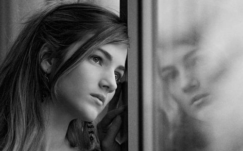 A woman looking out the window.