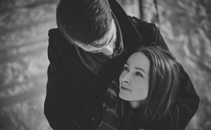 A couple looking lovingly at each other.