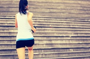 A woman running up steps.