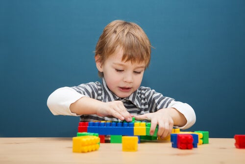 A child with some lego bricks.
