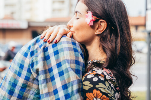 A couple hugging.