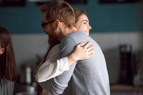 Two people hugging.