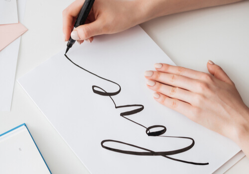 A person doing lettering.
