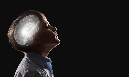 A little boy with an illuminated brain showing pediatric neuropsychology.