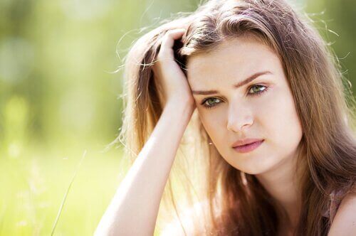 A pensive woman is one of those people who hides their feelings.