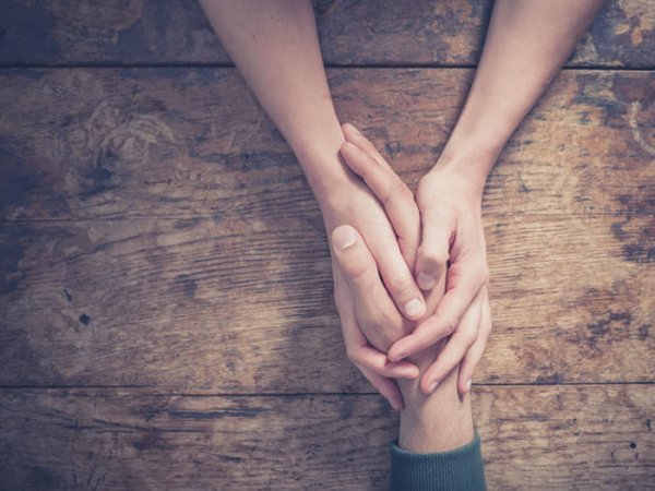 People holding hands.