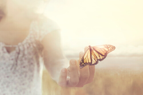 A woman with a butterfly.