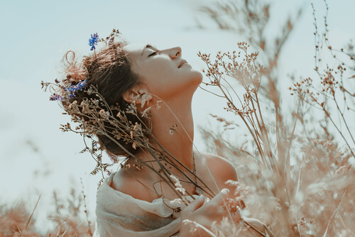 A woman with plants.