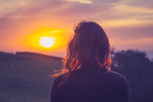 A woman and a sunset.