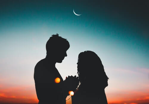 A couple gazing at each other's eyes.