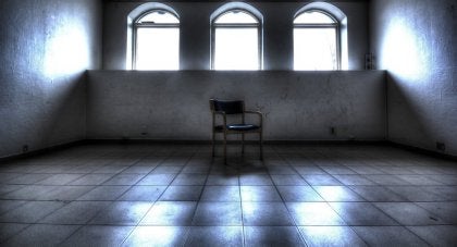 A single chair in an empty room.