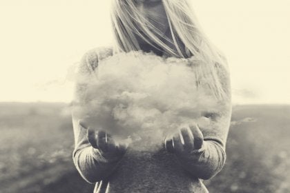 A woman holding a cloud.