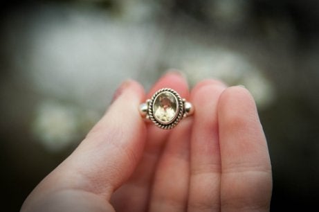A woman holding the ring.
