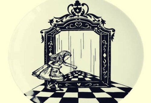 Alice looking at herself in a mirror.