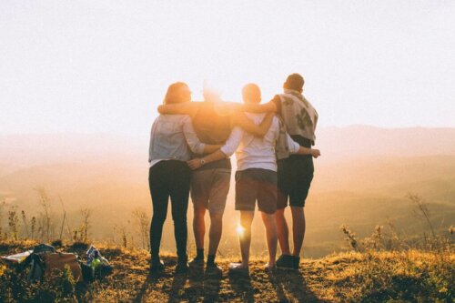 Four friends watching the sunrise.