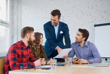 Four people at a business meeting.