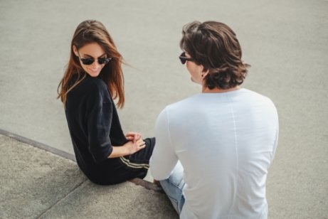 A man and a woman sitting together.