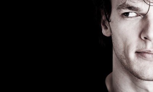 A man with psychopathy looking to the side.