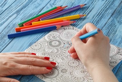 A person coloring mandalas