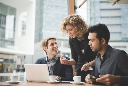 Three people at work.