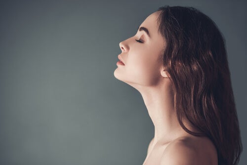 A woman practicing diaphragmatic breathing.