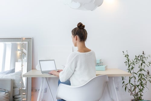 A woman working at a desk.