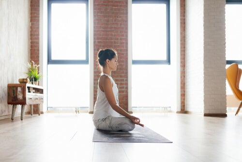 A woman practicing meditation.