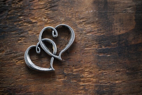 Two intertwined hearts.