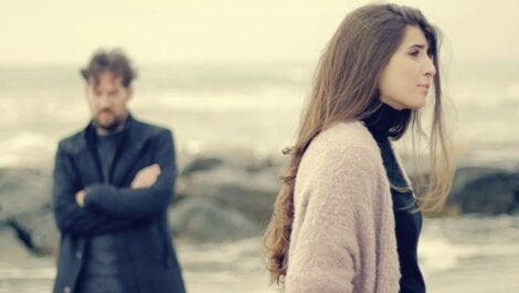 A couple fighting on the beach.