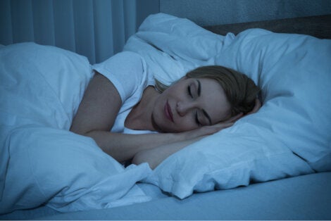 A woman sleeping at night.